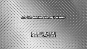 Adult drinking water after strength training session at Project Evolve Naples FL