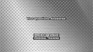 Coaches at Project Evolve answering member fitness questions in their Naples FL gym